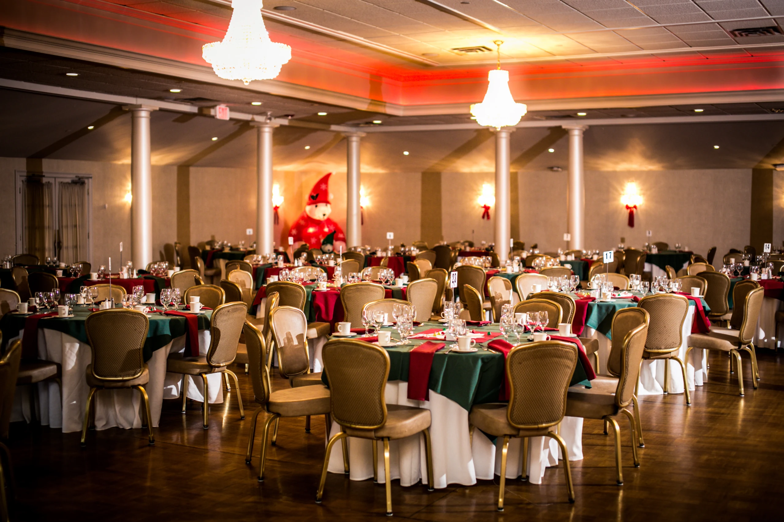 A Lake Pearl Wrentham ballroom set for a holiday celebration with red and green linens